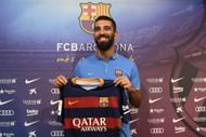 arda turan signs atletico madrid barcelona